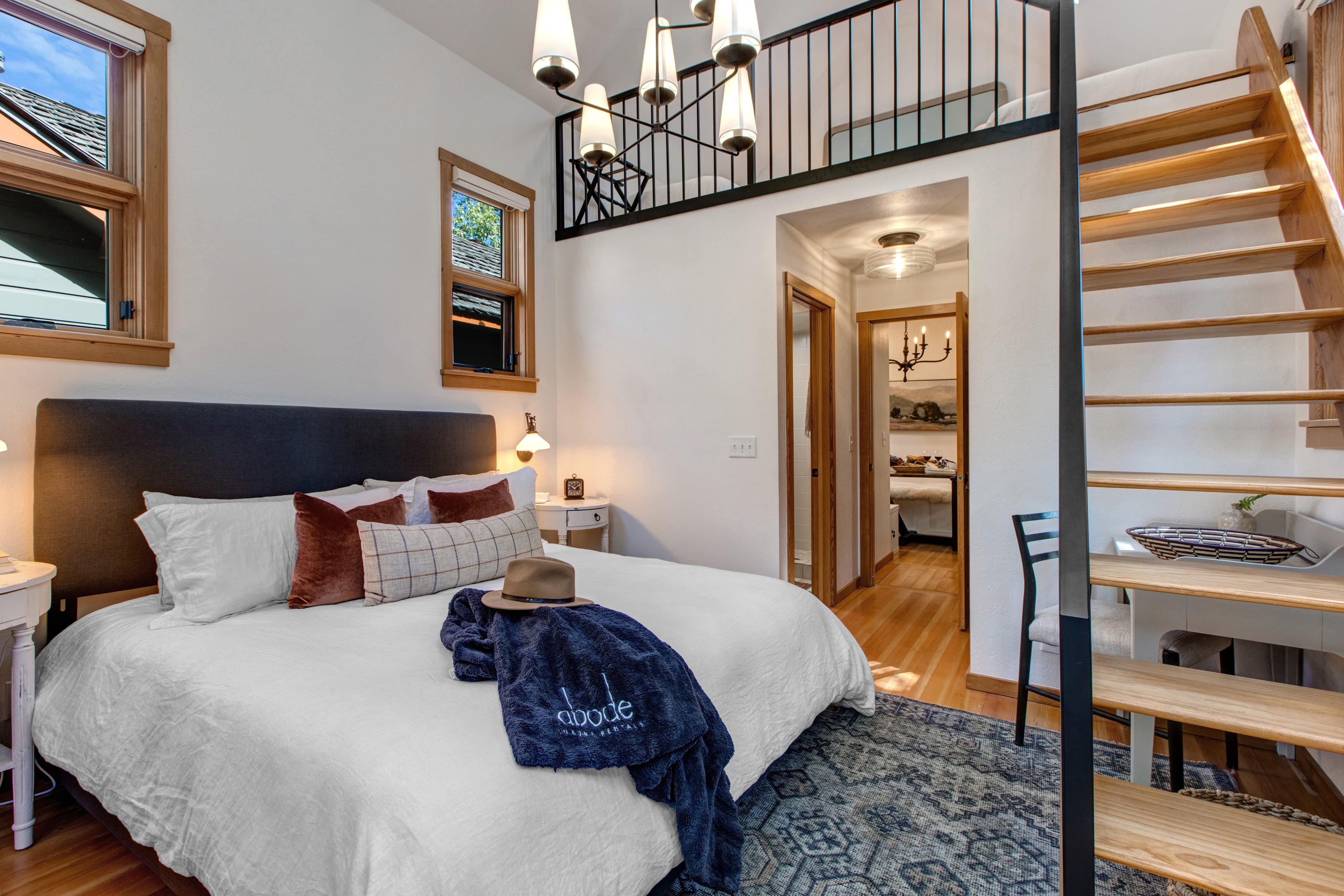 Master king bedroom, with ensuite bathroom and vaulted ceilings with a ladder up to an open loft with two additional twin beds.