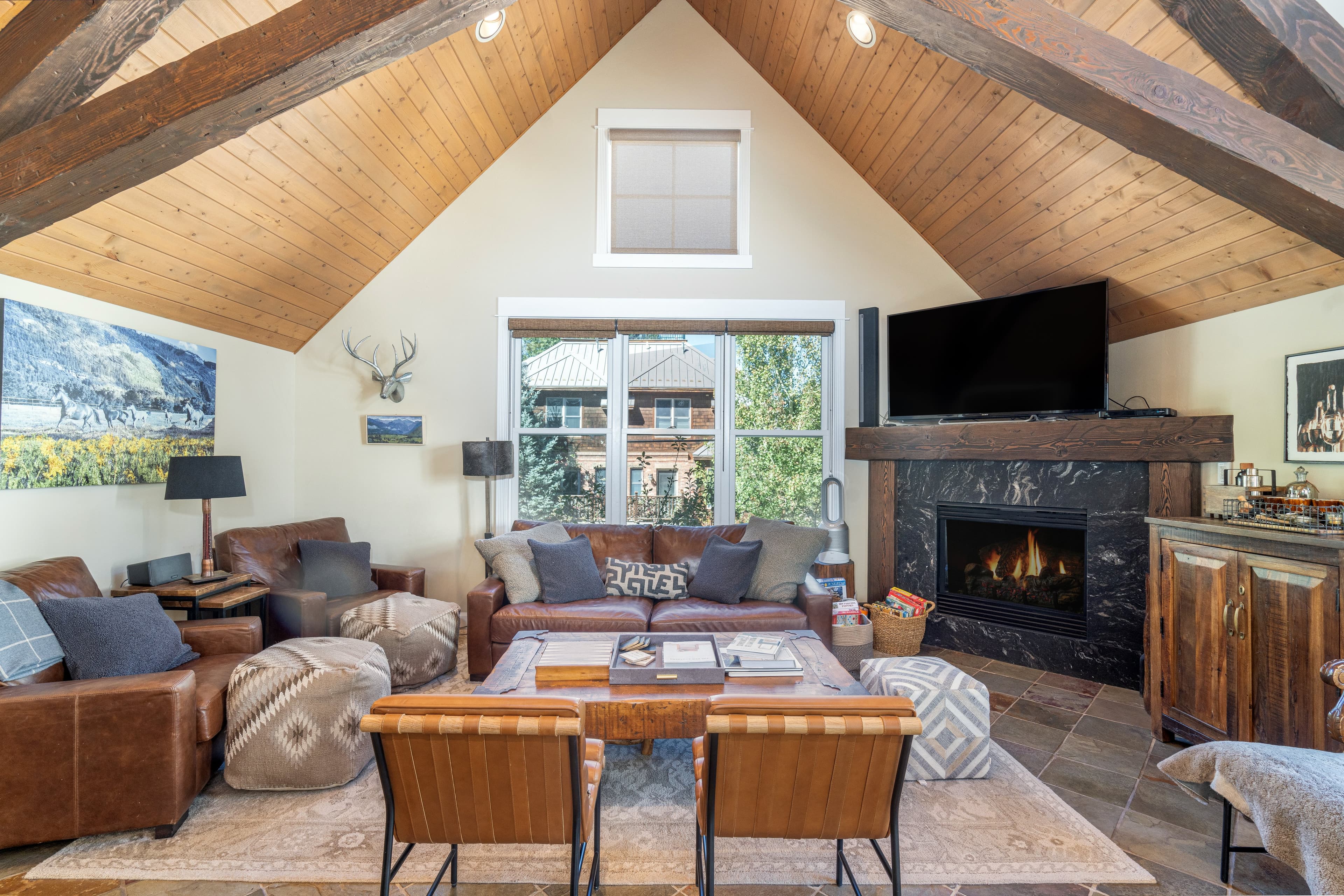 Such a cozy gathering spot in the great room with a fireplace.