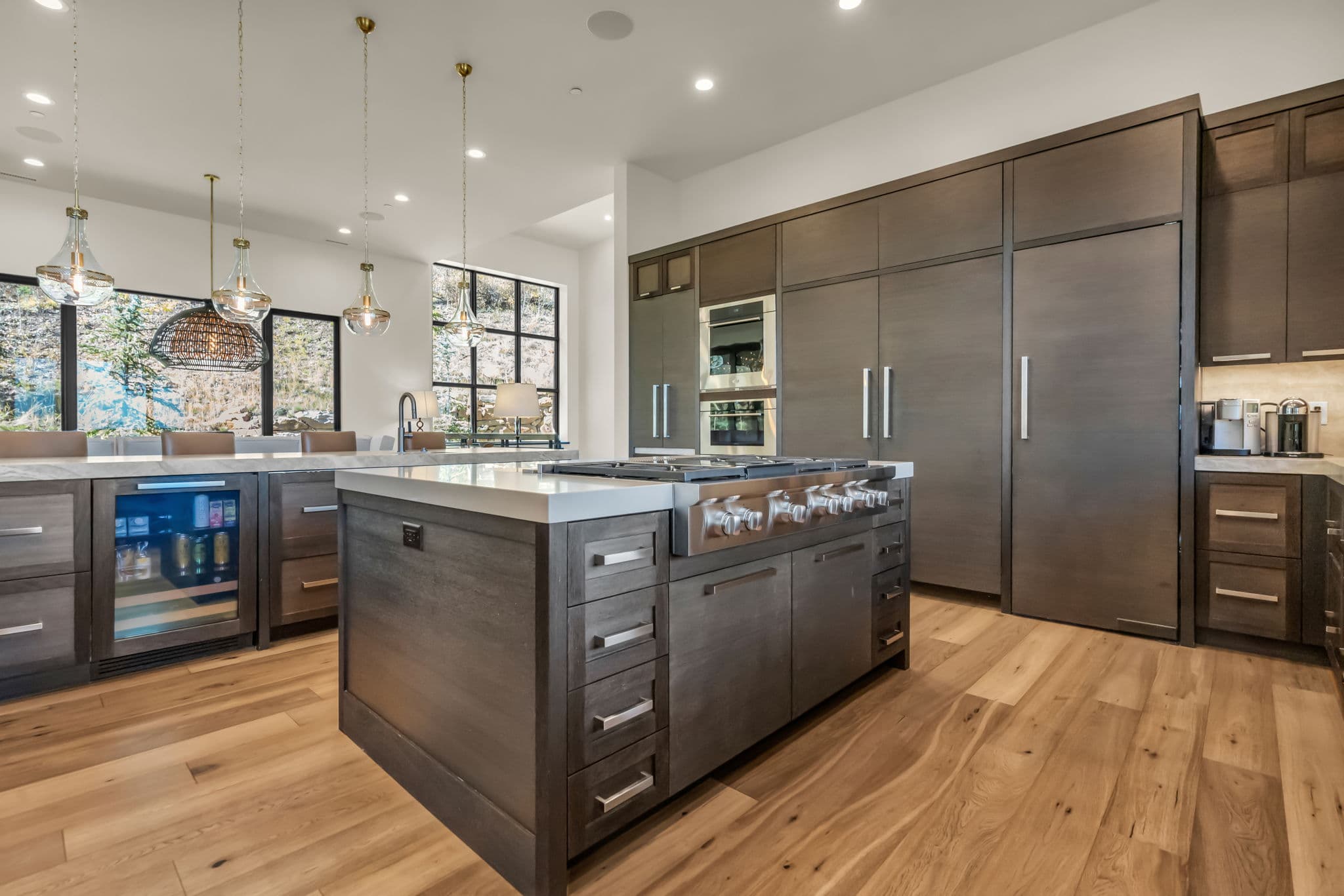 Kitchen Island with Range Cooker, Mini Fridge, Oven, and Pending Lamps