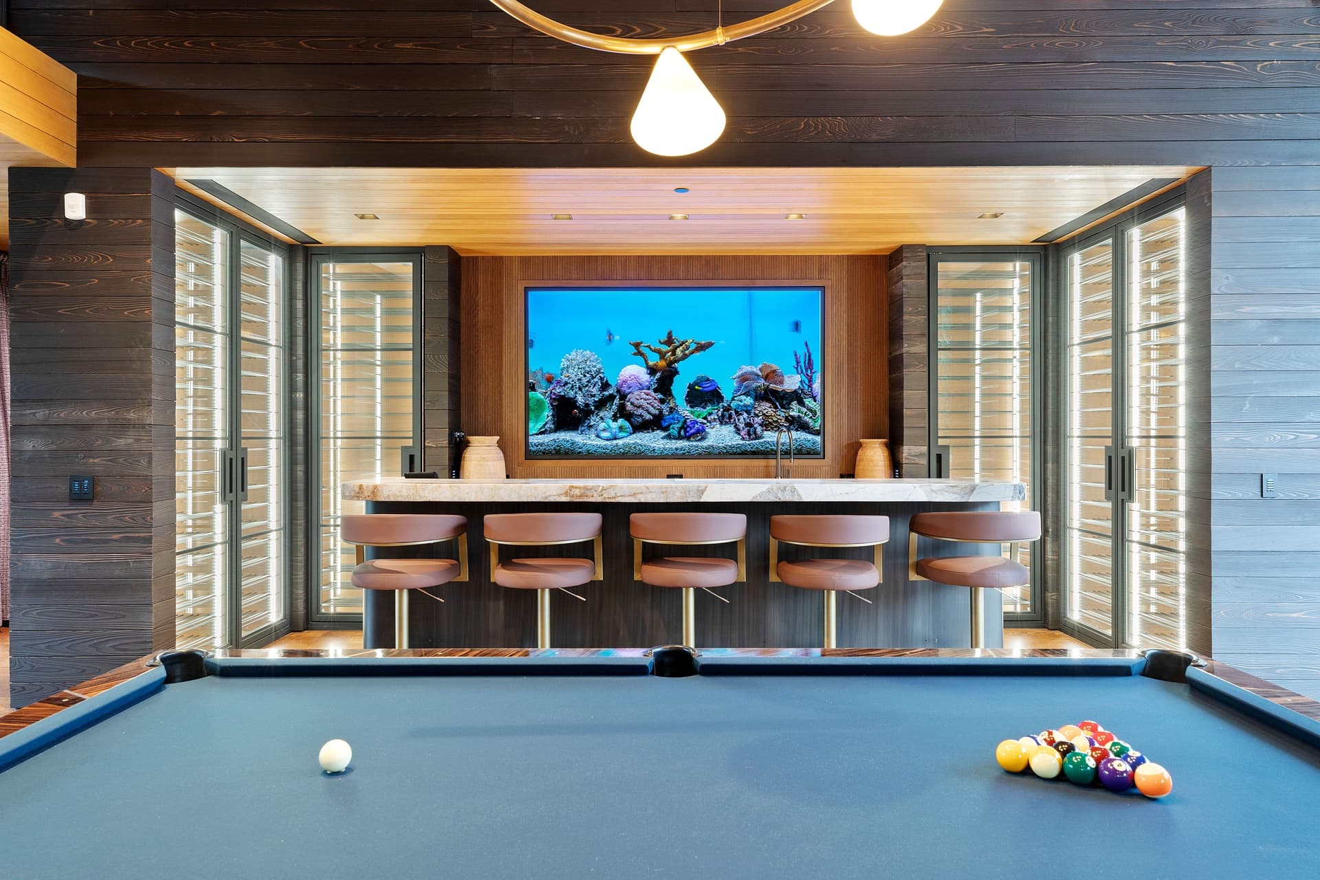 Game Room With Large Glass Doors and Bar.
