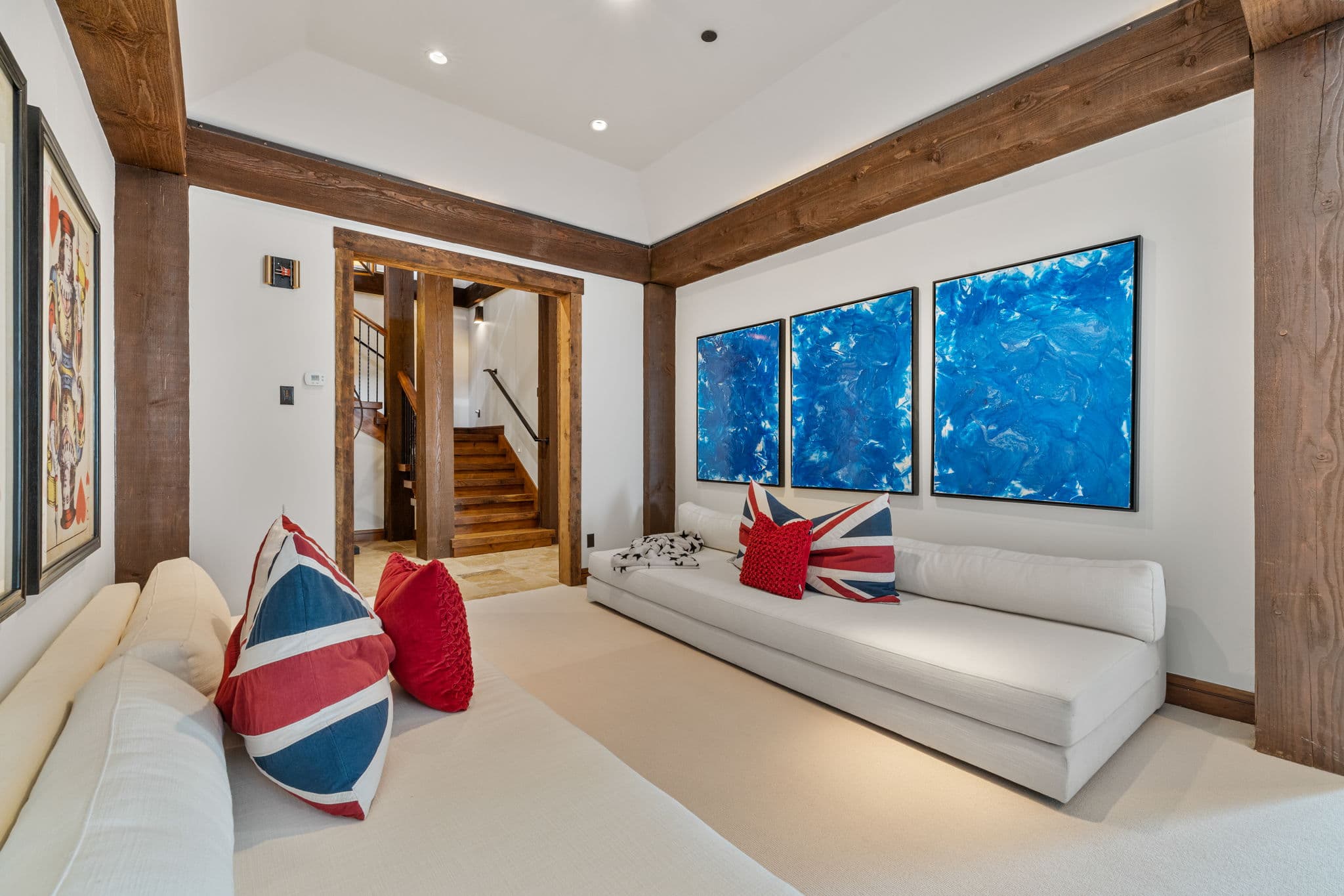 another view of the white couches and awesome artwork in the gameroom