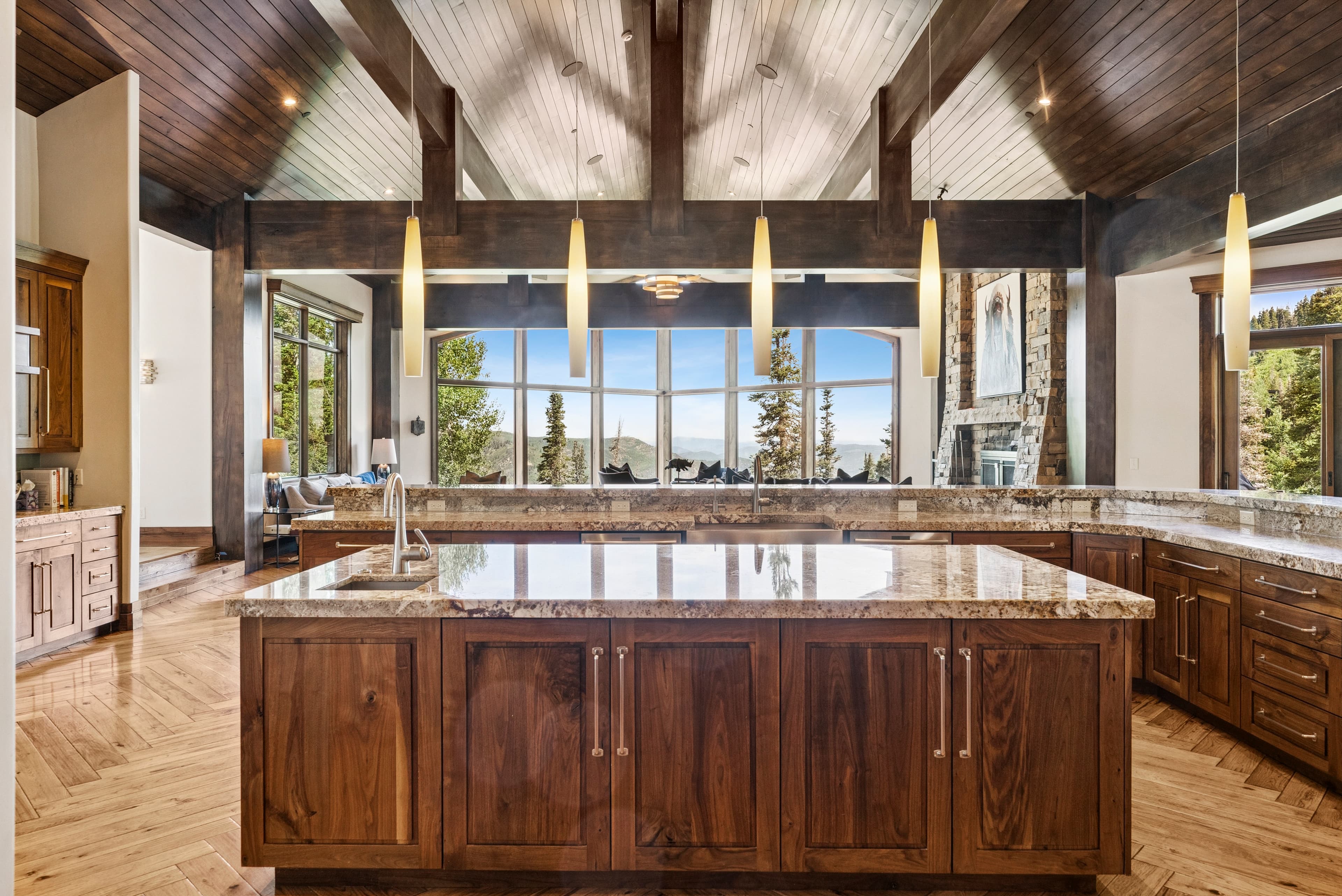 large kitchen island with views out a wall of windows
