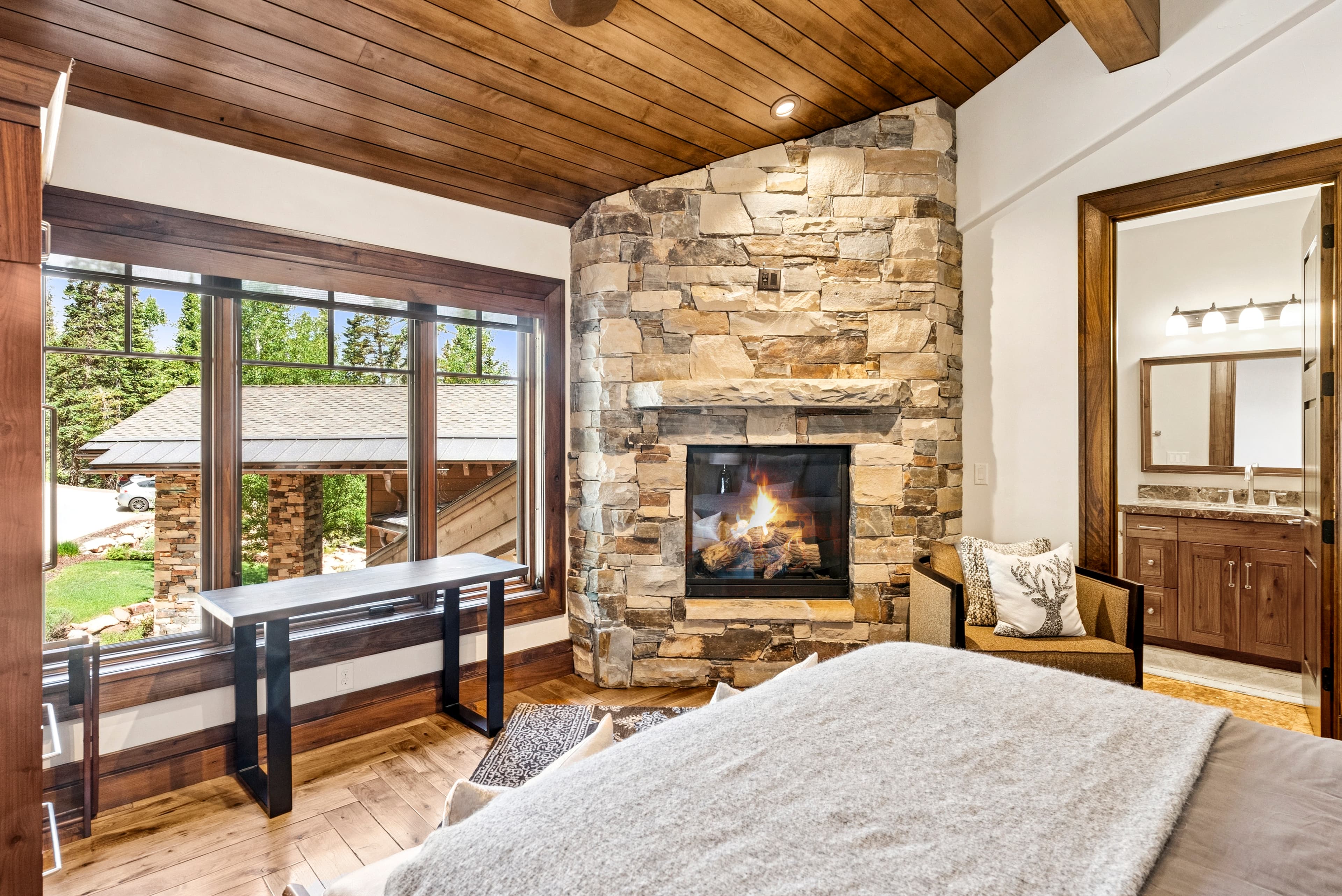 guest suite with grand views from tall windows opposite the bed