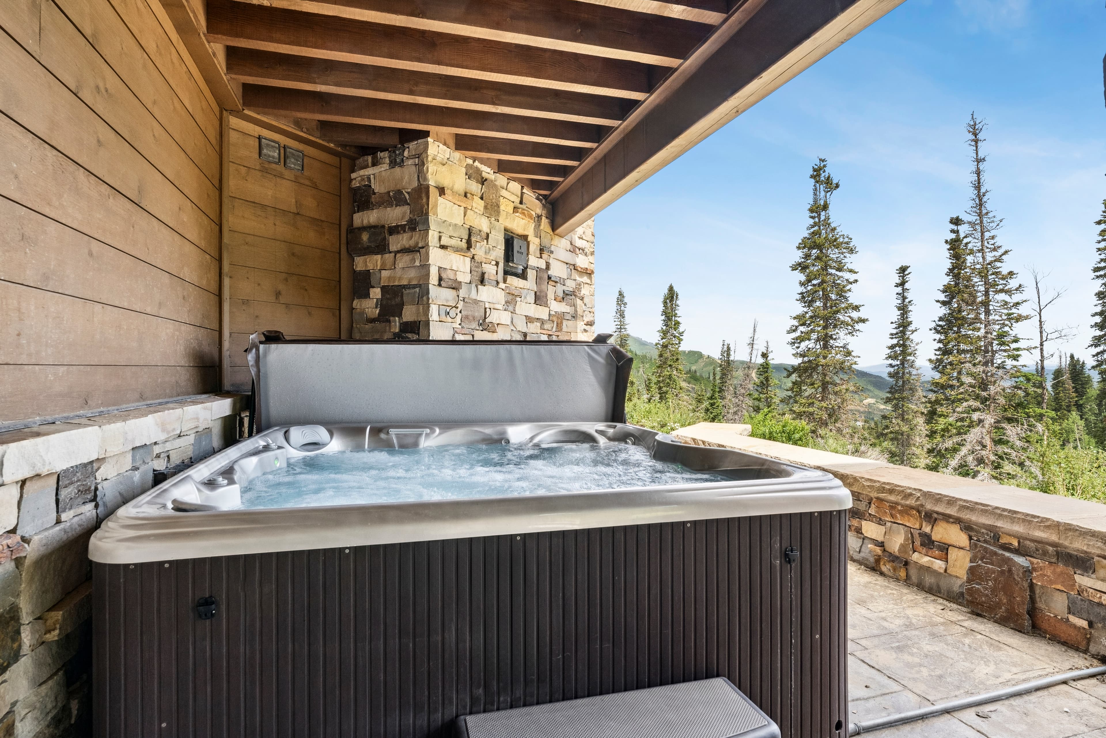 hot tub located on one of the balconies with ski run views