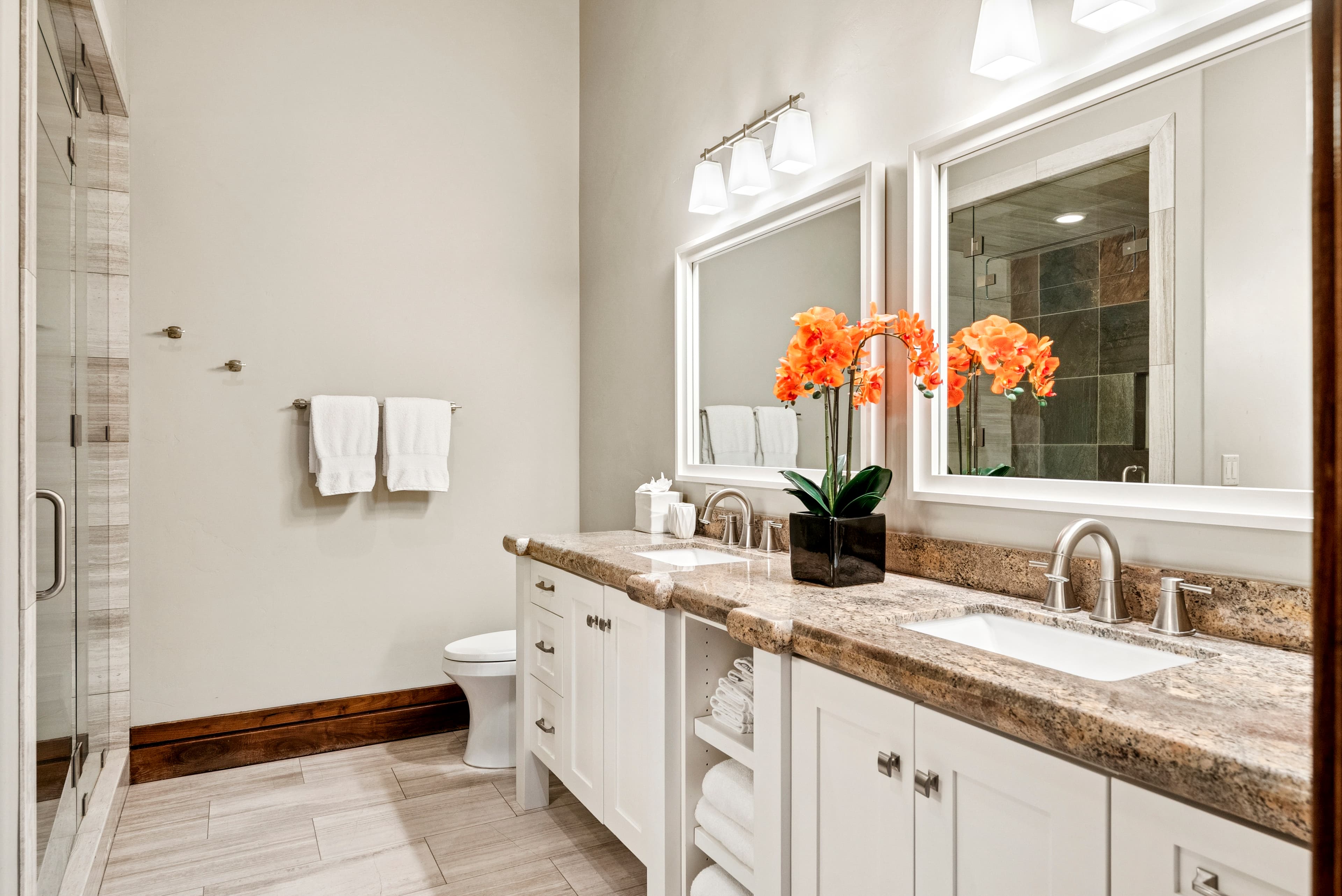 large bathroom at grandview with dual sink vanity, marble countertops and custom flooring