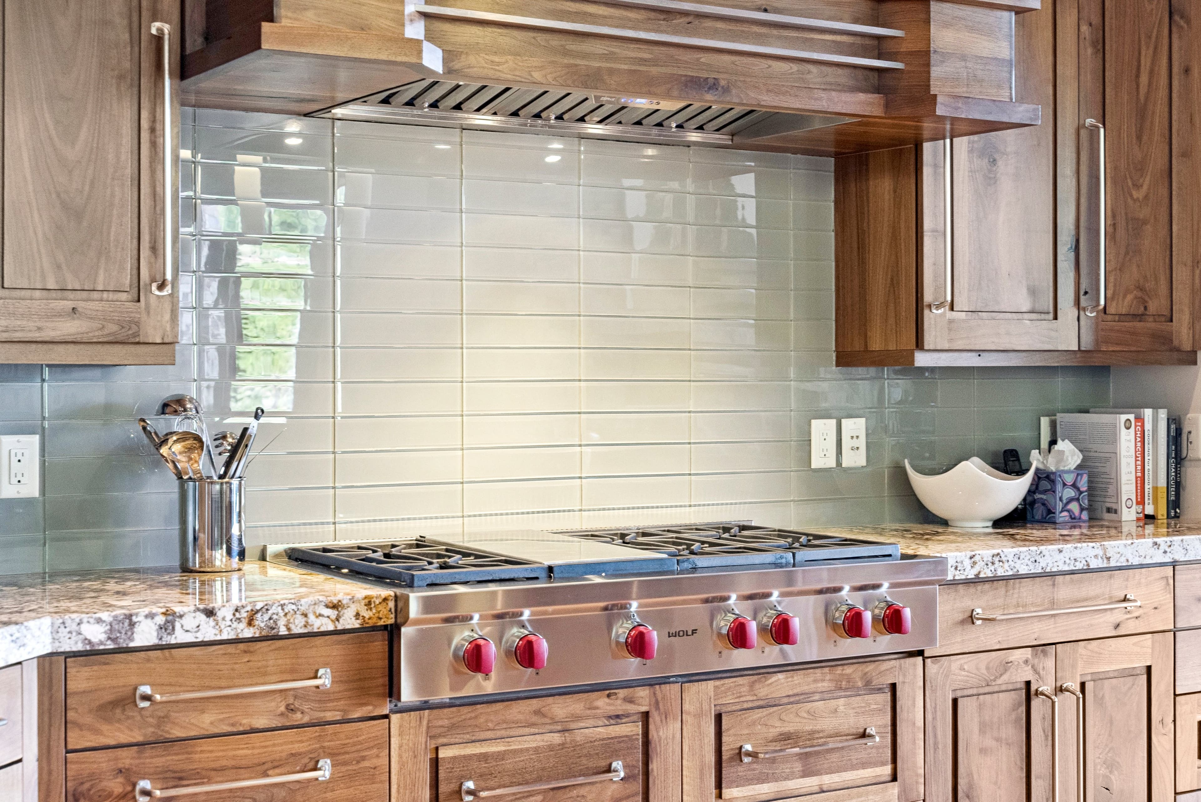 chefs stove with custom tile backsplash