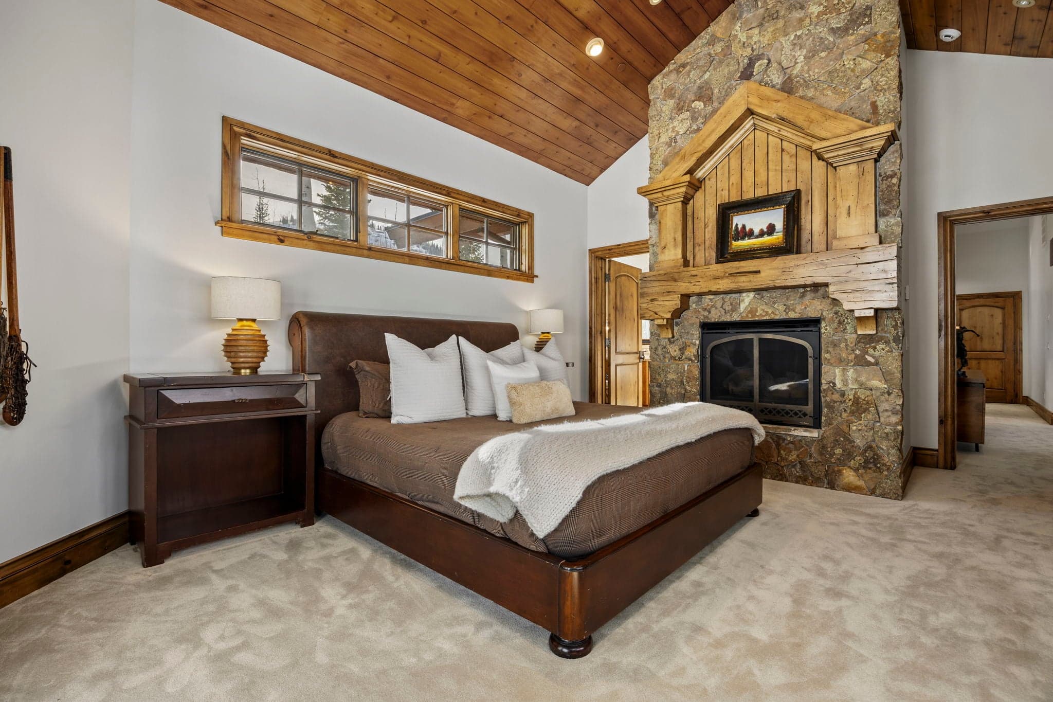 second primary suite with large fireplace